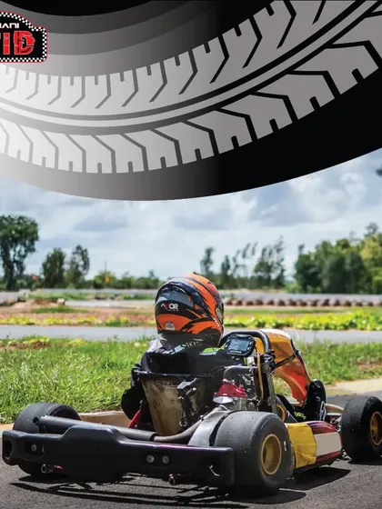 A driver sits ready on the track, waiting for the signal to go. This moment of calm before the storm is what every racer lives for.