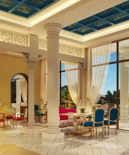 A wide view of the restaurant at IHCL Pilibhit-Haridwar, showcasing the blend of regal aesthetics and modern sophistication. The handcrafted furniture and intricate ceiling designs are curated to elevate the dining experience.