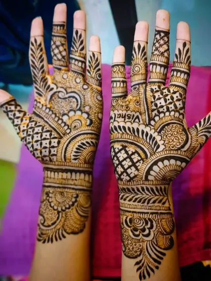 A full view of the hands, showing how the name is a central feature of the overall design.