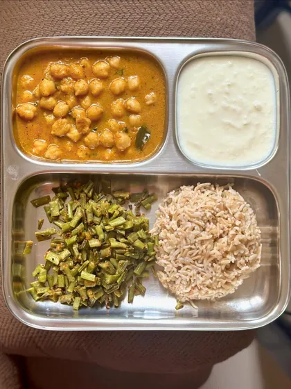 A repeat of my simple meal of brown rice, channa masala, sautéed beans, and curd.