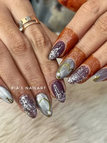 A unique bridal combination of purple cat eye and silver glitter nails, accented with delicate gold hearts. This shows how we can customize colors to match any bridal theme.