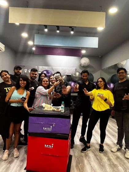 The whole crew celebrating our Bhangra instructor's birthday. The joy and camaraderie are evident as everyone gathers for a group photo.