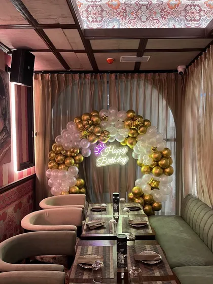 A wider view of the decorated dining space, showing how my setups can enhance a restaurant's ambiance.
