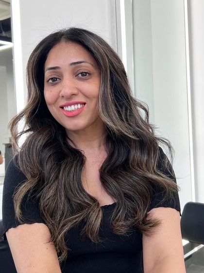 A signature balayage transformation using an air touch and backcombing technique to create soft, seamless highlights.