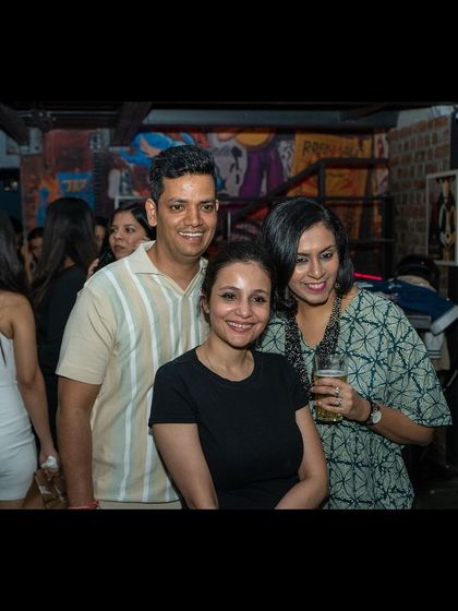 Friends posing for a picture during the event. It's a social and friendly atmosphere every single week.