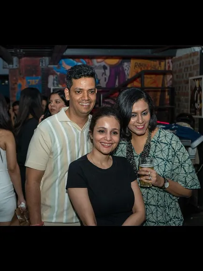 Friends posing for a picture during the event. It's a social and friendly atmosphere every single week.