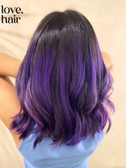 A back view of the purple balayage, showing the beautiful blend of colors in soft waves.