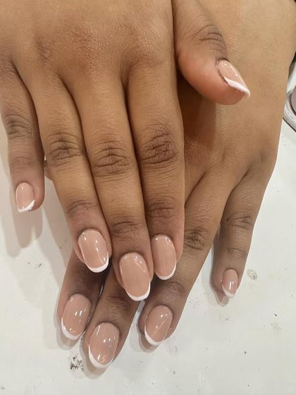 A simple and clean French manicure on short, natural nails. This is my go-to recommendation for a professional and low-maintenance look.