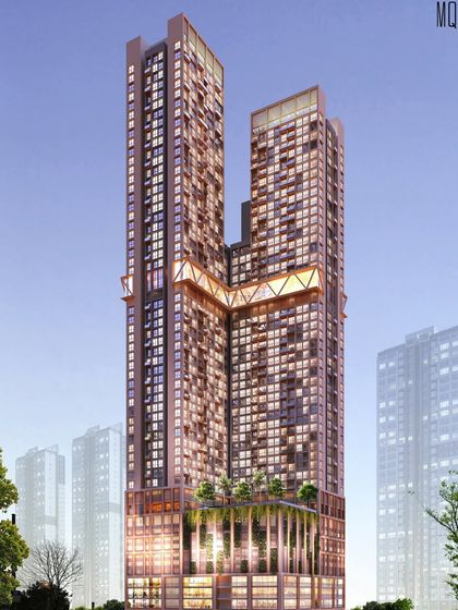 A nighttime render of the mixed-use residential tower, highlighting the illuminated sky-bridge and the vibrant retail podium.