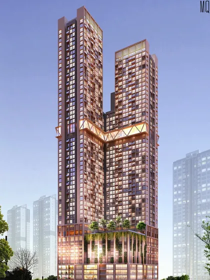 A nighttime render of the mixed-use residential tower, highlighting the illuminated sky-bridge and the vibrant retail podium.