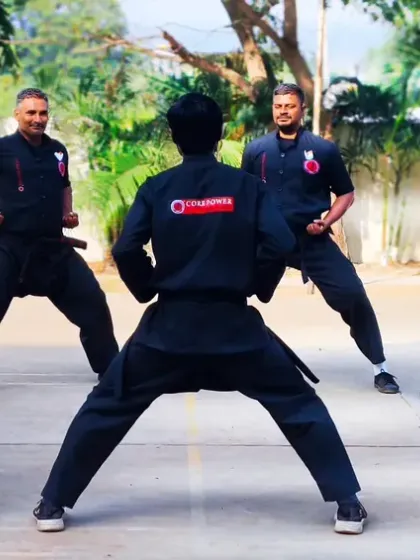 A circle of senior students practicing stances. This formation allows for close observation and correction, ensuring everyone maintains the correct posture and alignment.