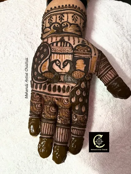 A close-up of my detailed figure work in a mehendi design. I love incorporating elements like peacocks and paisleys to create unique and personalized art for my clients.