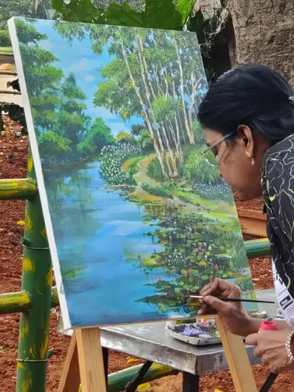 Painting the lotus pond at the 'Art in the Park' event.