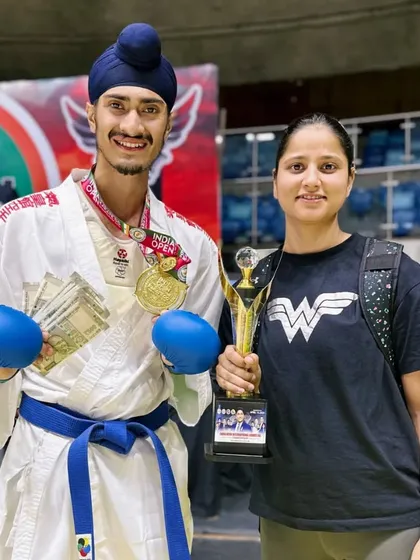 Celebrating the India Open win with my senior, Deepika Didi, who holds the trophy. Her mentorship has been vital to my growth as a karateka.