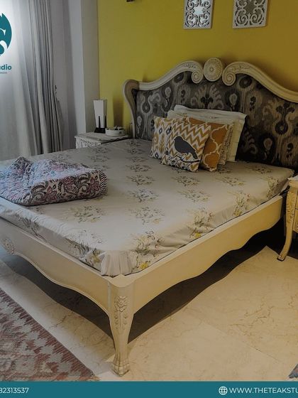 For those who love classic style, I craft beds with detailed carving and traditional silhouettes. This piece features an ornate headboard with a fabric insert, paired with matching carved side tables.