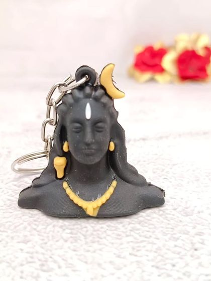 An exclusive keychain featuring the bust of Adiyogi Shiva, a modern and spiritual accessory.