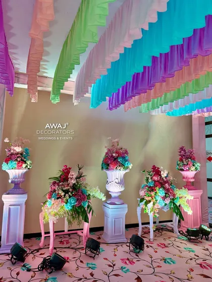 Another angle of the entrance decor, highlighting the soft lighting and the gentle colors of the flowers and drapes.
