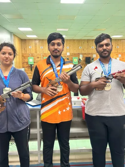 The winners of our weekly pistol final proudly displaying their medals. For those who get hooked, we offer a path to competitive shooting.