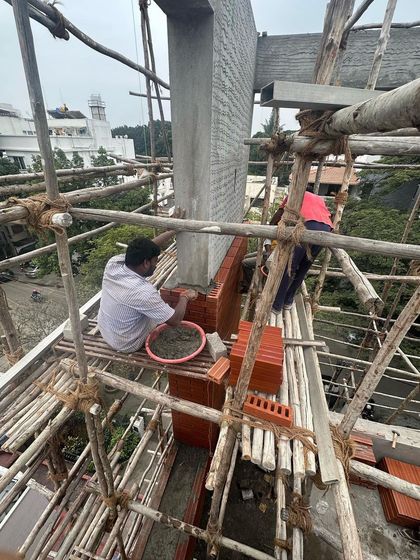 Duplicate image of the bricklaying process.