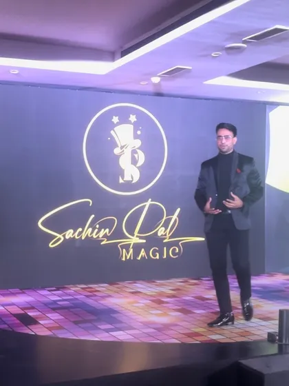 On stage with my logo in the background at an inDrive corporate event. A strong brand presence is key to a professional show.