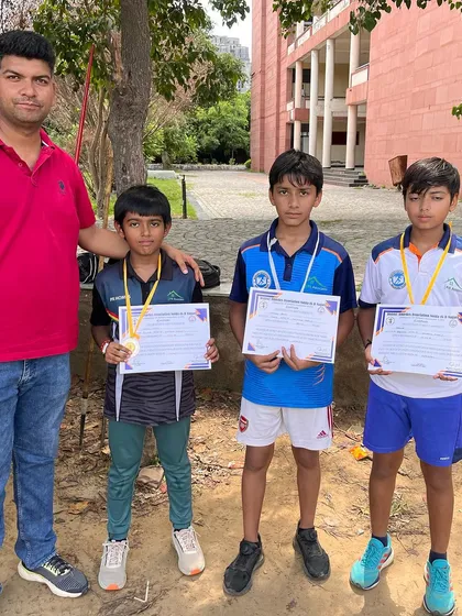 Our junior champions with their medals and certificates. We celebrate their early successes to build their confidence for the future.