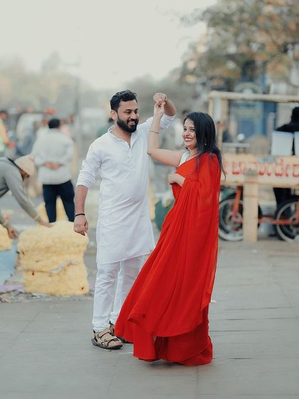 A spontaneous dance in the middle of a bustling market street. This captures the joy and energy of the city.