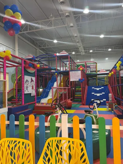 A view of our play area from the cafe, decorated with balloons for our 5th-anniversary celebration. It shows how the entire space comes alive during special events.