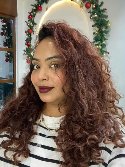 A festive shot with my winter curls. The holiday season is busy, and I don't stress about having perfect hair every day.