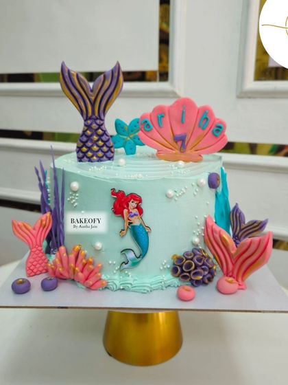 Dive into the magic with our mermaid-themed cake. This design features Ariel, colorful coral, and shimmering mermaid tails to create a perfect under-the-sea celebration.