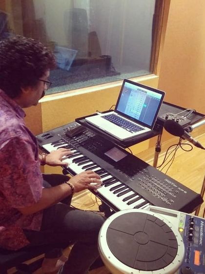 Music is a key part of our storytelling. Here, a maestro is at work composing the score for our show 'Some Some Story'.