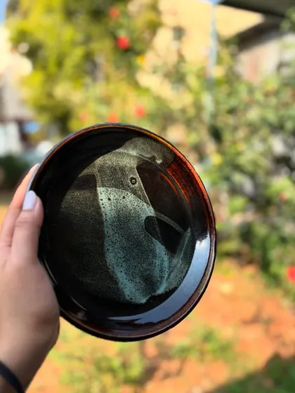 A final look at this stunning Tenmoku and Chun plate. Each one we make has a completely unique pattern from the interaction of the glazes in the kiln.