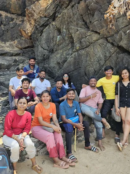 Our group enjoying the rocky landscape during the Gokarna beach trek.