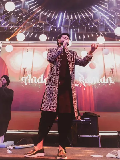 Performing on stage with the 'Andaaz-e-Raman' branding. We bring a professional and personalized touch to every Sufi night.
