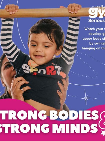 Hanging on the bars is more than just play; it's a fundamental exercise for developing grip and upper body strength in toddlers. With a parent's supportive hands, children learn to trust their own strength and build the confidence to try new things.