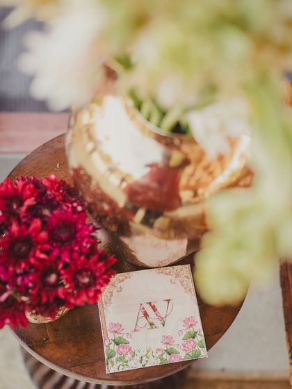 A close-up of the personalized monogrammed coaster, a small touch that makes the event feel truly unique to the couple.