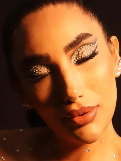 For those who love to experiment, here is a creative look I designed. This features a dramatic winged liner fully embellished with rhinestones for a high-fashion, sparkling effect that's perfect for a bold photoshoot.