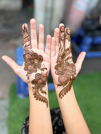 This is a beautiful example of an Arabic-style floral design, which typically features flowing vines and flowers rather than full coverage.