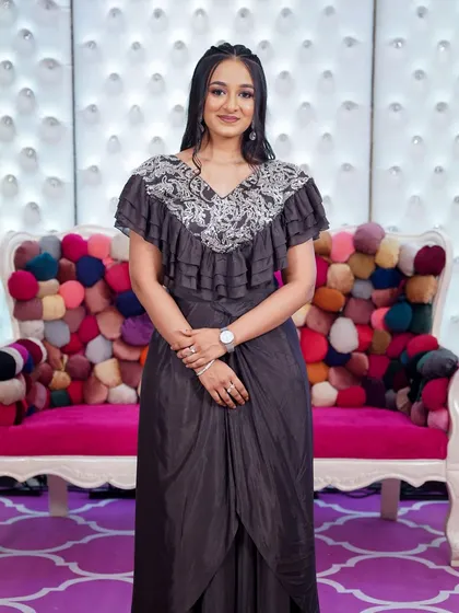 A full-length shot showing how a bold eye can balance a dramatic outfit. This look is perfect for a formal evening event.