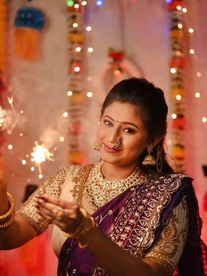 Celebrating Diwali with sparklers, this image captures the joy and light of the festival.