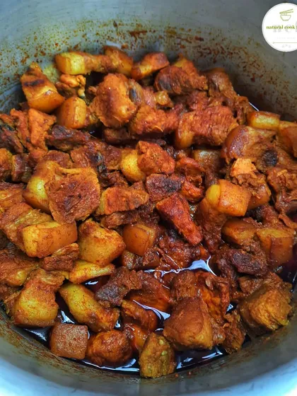 A simple and delicious pot of pork curry, ready to be enjoyed.