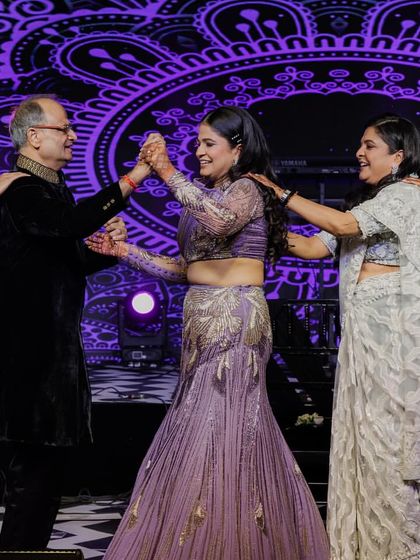 A heartwarming moment with the bride dancing with her parents and in-laws. Family is everything.