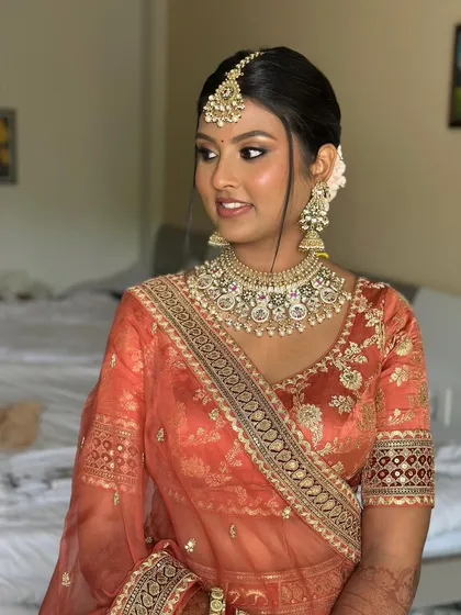 A close-up of this radiant bride. The makeup is blended seamlessly to honor her natural skin tone while adding a touch of bridal glam.