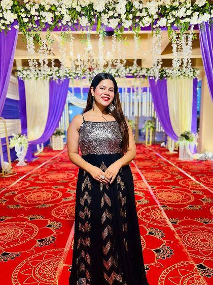 Posing in a beautiful sequined gown at the entrance of a Sangeet venue. The decor was stunning.