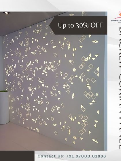 A modern backlit Corian panel featuring a scattered pattern of small geometric shapes. When illuminated, the wall comes alive with a gentle, sparkling glow, creating a unique ambient feature.