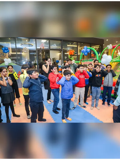 Kids fully engaged in a group game led by our party coordinator. I ensure the entertainment is structured and fun for everyone.