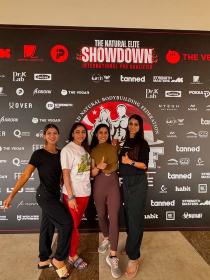 Supporting my team of female athletes at the WNBF Singapore competition. As a coach, I'm there for my clients every step of the way, from the gym to the backstage pump-up.