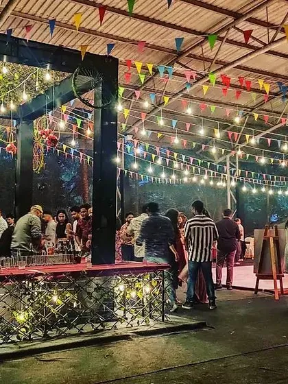 The bar area during a party, fully stocked and ready to serve. Our packages can include unlimited drinks to keep the celebration going.