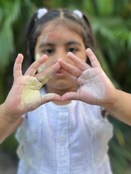 A fun pose with hands covered in my natural Holi powders. They are easy to wash off and are kind to the earth.