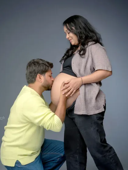 A tender and iconic maternity pose, with the father-to-be kissing the baby bump. It is a simple yet deeply emotional moment that I love to capture for my clients.