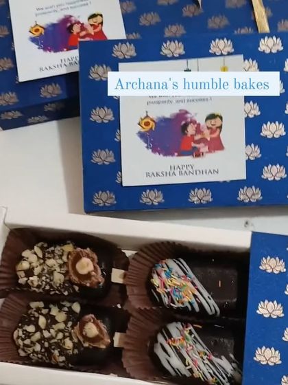 A close-up of the assorted chocolate nut bars inside one of my Rakhi gift boxes. These are covered in rich chocolate and topped with crunchy nuts and sprinkles.